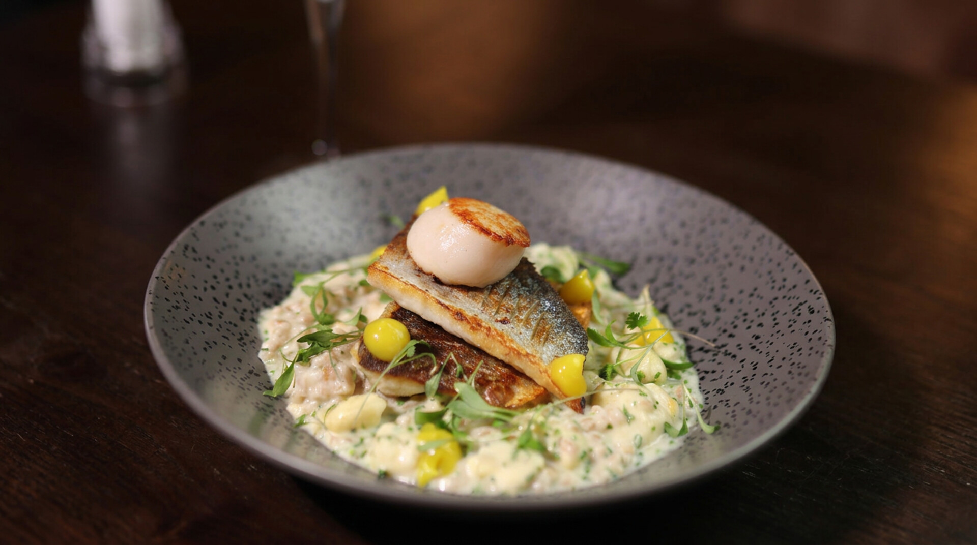 Sea bass and scallop dish served at The Glasshouse restaurant in Windlesham